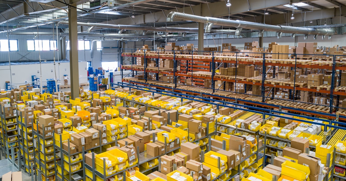 Warehouse aisle with stacked inventory—evaluating 3PL operations beyond cost